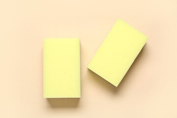 Cleaning sponges on beige background