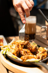 Classic American brunch spread featuring fluffy buttermilk pancakes with maple syrup, crispy bacon strips and perfectly scrambled eggs, served on rustic wooden table with fresh orange juice and coffee