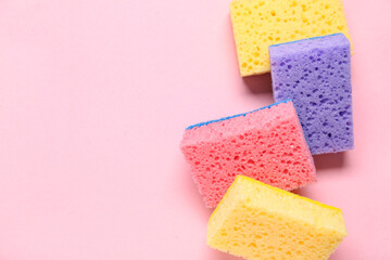 Cleaning sponges on pink background