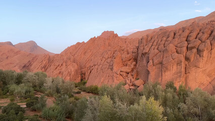 A trip to Sahara desert in Morocco. Beautiful 
african travel photo. Stone landscapes,  mountain, 
canyon, and nature. Summer vacation in arab country.