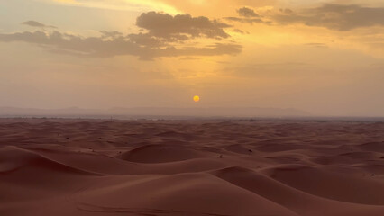 A trip to Sahara desert in Morocco. Beautiful 
african travel photo. Sandy landscapes,  
dunes, and nature. Summer vacation in arab country.