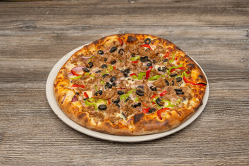 Pancetta pizza with crispy smoked pancetta, roasted onions, egg, and freshly ground black pepper