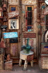 Egypt, Dahab - February 2022: Rustic display of antique Egyptian objects and vintage household items at a local bazaar. Warm tones and cultural atmosphere perfect for travel, history, and editorial