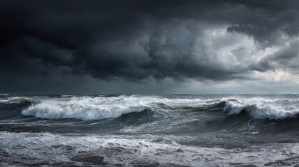 Obraz premium Dark storm clouds loom over the choppy waters creating a dramatic scene of crashing waves and an intense atmosphere during late afternoon.
