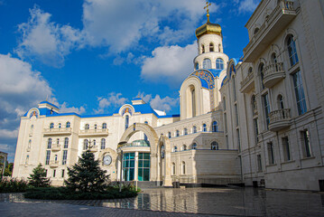 The building of the international academic school in Odessa.
The richly decorated building with neoclassical architecture has a central golden dome topped with a cross.