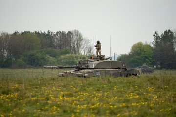 British army Challenger 2 II FV4034 main battle tank with Warrior FV510 IFV in action on a military exercise