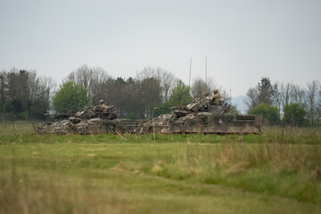 British army Challenger 2 II FV4034 main battle tank with Warrior FV510 IFV in action on a military exercise