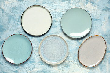 Different clean plates on light blue background