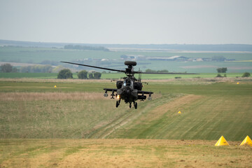 close-up front view of a hovering Boeing Apache Attack helicopter AH2 AH64E AH-64E ArmyAir gunship