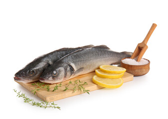 Board with fresh sea bass fish, thyme twigs and lemon isolated on white background, closeup