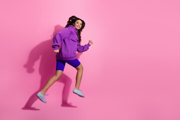 Active Young Woman Posing in Trendy Sportswear on Pink Background Promoting Fitness and Lifestyle