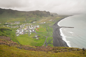 View onto the town Vik in Iceland from a mountain