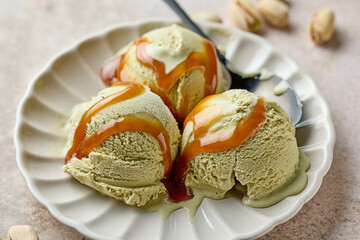pistachio ice cream scoops on beige plate