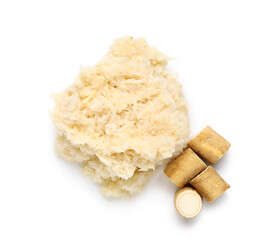 Horseradish sauce with root on white background