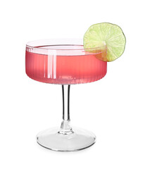 Glass of tasty Cosmopolitan cocktail garnished with lime slice on white background