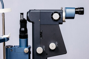 Ophthalmic examination equipment featuring a laser vision correction device, showcasing intricate details and controls, emphasizing advanced technology in vision care and diagnostics