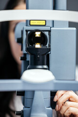 Laser vision correction equipment is being prepared for a vision examination, showcasing advanced technology and precision in ophthalmology for enhanced patient care and outcomes