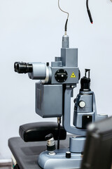 Ophthalmology equipment featuring advanced laser vision correction technology, showcasing intricate details and precision mechanics in a clinical examination setting for vision assessment