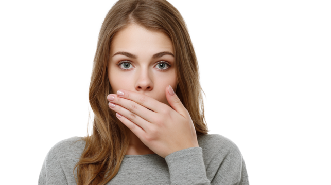 Young woman showing surprise or shock with hand over mouth, bright background highlighting her expression and soft features, conveying an instinctive reaction to unexpected news or event