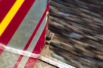 Old red train view with a motion blur defocused background diagonal composition