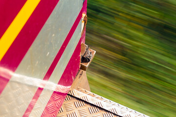 Old red train view with a motion blur defocused background diagonal composition