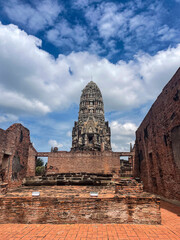 Old Buddhist temple ruins in a green park landscape in Ayutthaya, Thailand