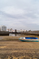 White Rowboat and Volcanic Walls, Lanzarote © WildFrame