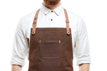A bearded man models a professional brown work apron with leather straps over a classic white buttoned shirt against a solid  isolated on transparent background, perfect cutout, PNG