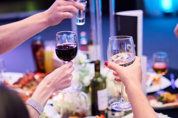 Hands Raising Glasses at Party Celebration