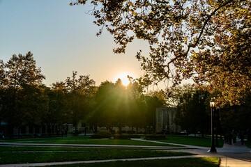 The sun setting on the campus of the University of Notre Dame on a bright sunny day