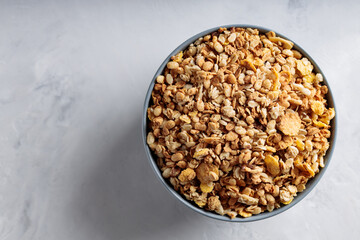 Homemade Crunchy Granola with Oats and Nuts on Concrete Surface Top View Copy Space
