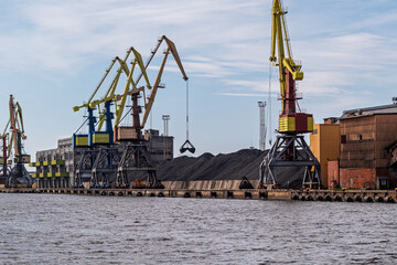Coal terminal in the port. Large cranes at the coal handling terminal