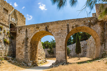 Bridge leading to the Rhodes old town gate in the Medieval moat, Rhodes Town, Rhodes, Greece