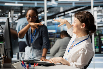 Happy data center colleagues in good mood after after successfully improving system efficiency...