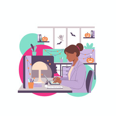 Smiling woman working at a festive Halloweendecorated office desk balancing work and holiday spirit