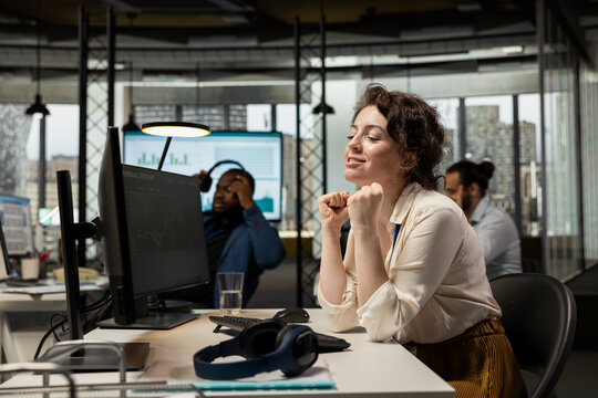 Successful finance advisor studies stock exchange trends benefit, financial improvement and economic growth due to candlestick charts going upward. Woman pleased about wealth opportunity.