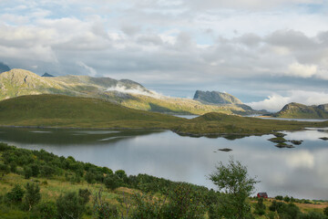 Obraz premium Mountain lake and islands in golden light