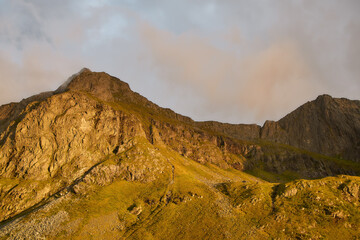 Sunlit mountain peak in Norway