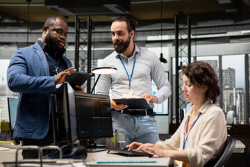 Corporate manager and employees consulting on a new strategy, overseeing performance metrics and collaborative insights to drive project success and organizational growth. Partnership.