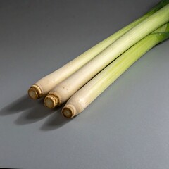 Fresh Lemongrass Stalks on Gray Surface - Culinary Herb Ingredient.