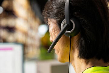 Close up of customer service staff responding to issues like lost parcels or order mix up, working...