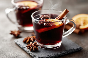 Mulled Wine with Cinnamon Stick Orange Slice and Star Anise in Glass Mugs