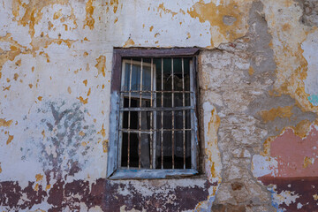 close-up of abandoned house wall and window