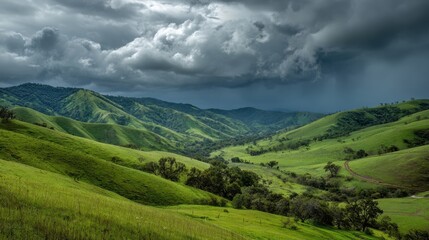 Fototapeta premium Rolling green hills are framed by dark clouds creating a dramatic and captivating scene.