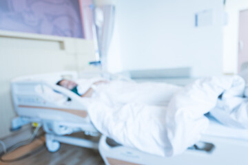 Blur image of patient on bed and nurse working area in internal medicine departments at the hospital.Medical treatment emergency patient.Caregiver and hopeful concept.