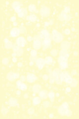 Bright and ethereal abstract background with soft focus glowing light circles; gentle yellow backdrop with shimmering bokeh effect.