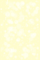 Soft glowing yellow bokeh lights create a dreamy and ethereal background texture for festive celebrations and elegant designs.