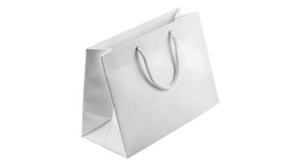 A clean white paper shopping bag with rope handles isolated on transparent background
