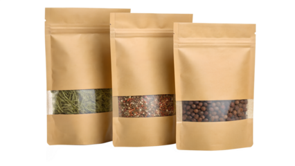 Three kraft paper stand up pouches with clear windows showing contents isolated on transparent background