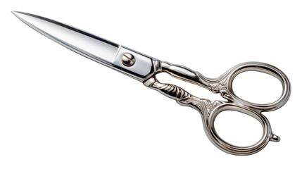 Fototapeta premium A detailed close-up of ornate antique silver scissors with intricately designed handles, resting on a plain gray studio background.